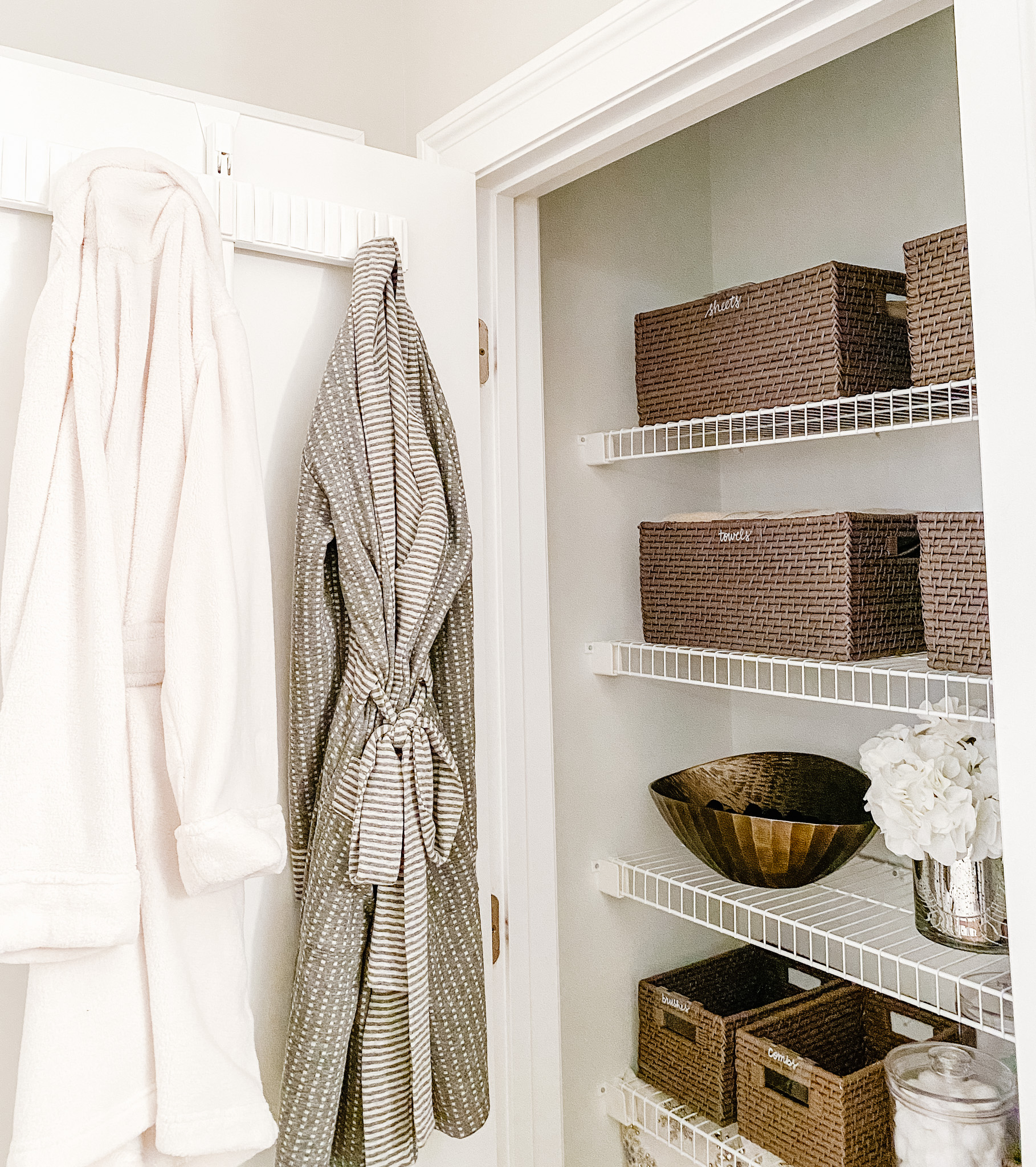2 Ways to Organize Your Linen Closet Using an Elfa Door Rack - Pinch of ...